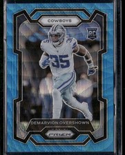 2023 Panini Prizm Demarvion Overshown Blue Wave Prizm RC 099/199 #323 Cowboys