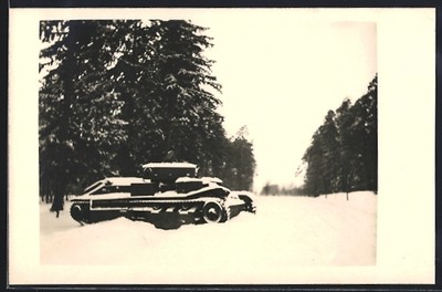 Photo postcard tanks at the edge of the forest in winter 