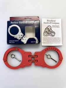 USED/ETCHED Peerless Model 850 Hinged Color Plated Handcuffs, Orange