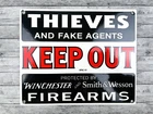 VINTAGE WINCHESTER SMITH & WESSON THIEVES KEEP OUT PORCELAIN GAS OIL SIGN