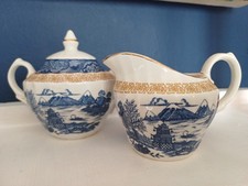 Grindley Staffordshire, blue and gold creamer and lidded sugar bowl.