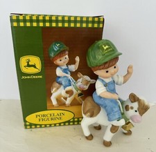 2000 ENESCO JOHN DEERE PORCELAIN FIGURINE FARMER BOY RIDING COW NEW IN BOX