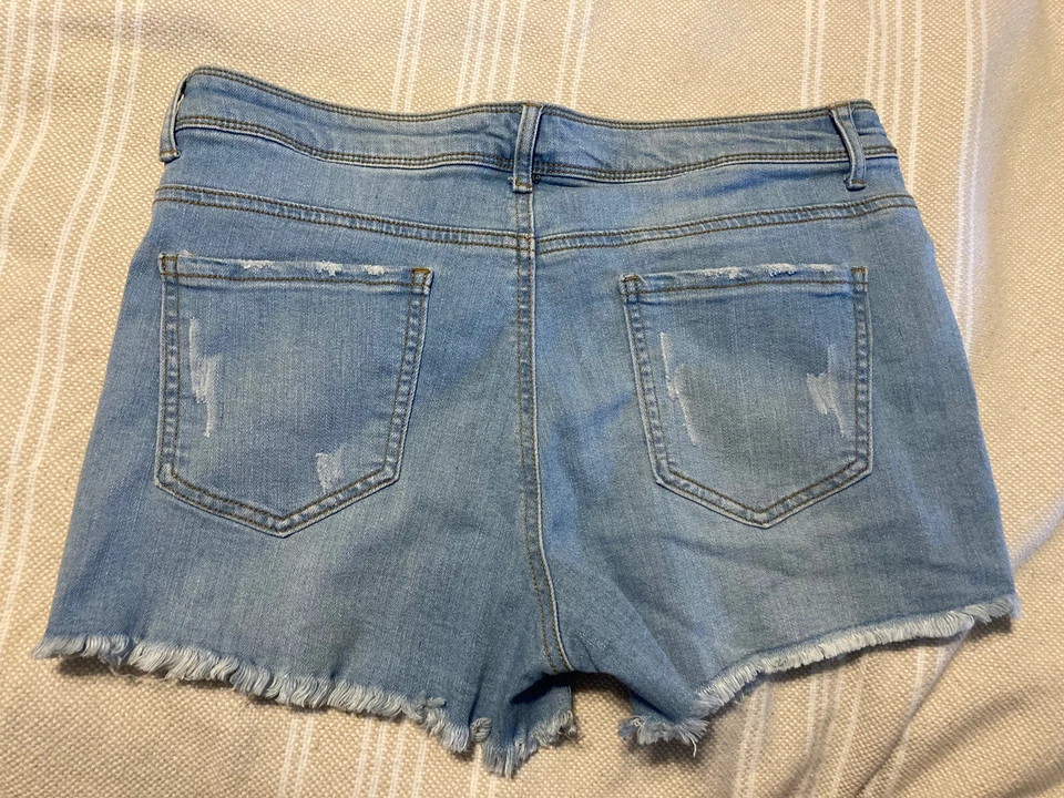 Pantalones cortos de mezclilla azules ajustados desgastados talla L Nine Planet para dama Foto 3 de 3