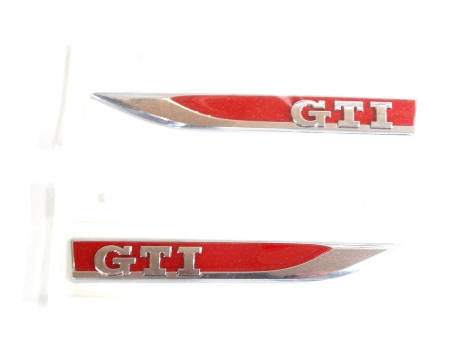 Original VW Golf 6 7 GTI Schriftzug Emblem Logo Kotflügel selbstklebend 2 Stück - Bild 1 von 1