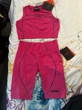 Reggiseno donna Yokkao M/L Yoga rosa e set corto Muay Thai Essential