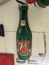 two vintage antique 7up bottle advertising signs