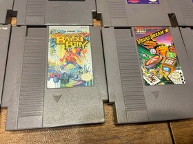 Lot of 8 Nintendo NES games including Mega Man 2 And 3 Mario 2 And 3 WWF Etc
