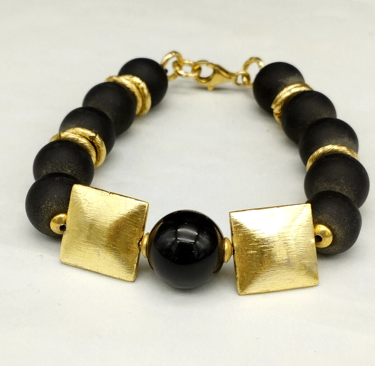 Bracciale Ossidiana Marrone con elemento tibetano, elastico, sfere 10mm