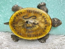 RARE Antique Cast Iron Turtle advertising Teutonia Bank of New Orleans Celluloid