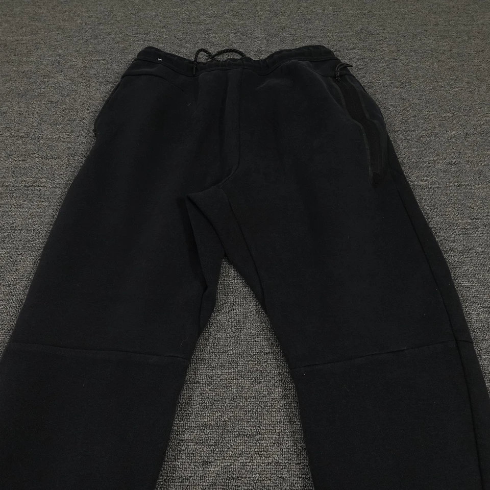Pantalones Nike Juveniles Medianos Negros Tecnología Polar Joggers Pantalones de Sudadera con Puños Cónicos Foto 4 de 4