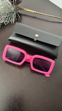 Women's pink sunglasses with a case.
