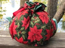 Green Teapot with warming Snuggie Cozie in Poinsettia print with ribbon closure