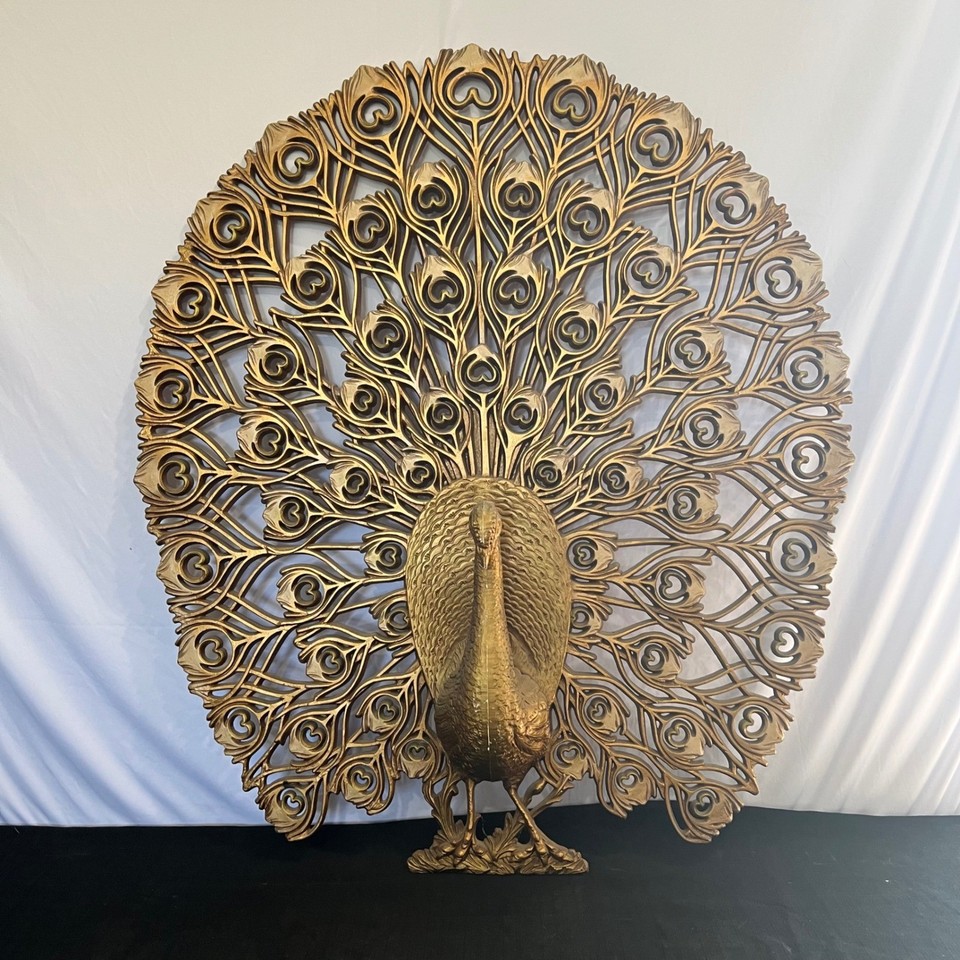 A massive 33x30" Dart Industries gold peacock wall hanging — gloriously maximalist MCM kitsch that commands an entire room and is genuinely hard to find at this scale.