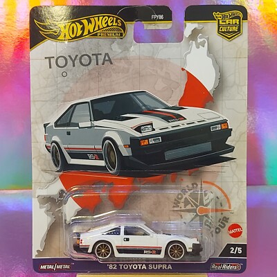 Hot Wheels Premium ' 82 TOYOTA SUPRA - NEU - WORLD TOUR 2/5 - 1:64 Sammler FPY86