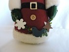 Fabric Santa with Weighted Bottom Holding Garland Between Hands — photo 6