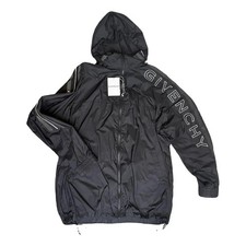 This Givenchy jacket is a black fullzip tracksuit top with a sleek modern design