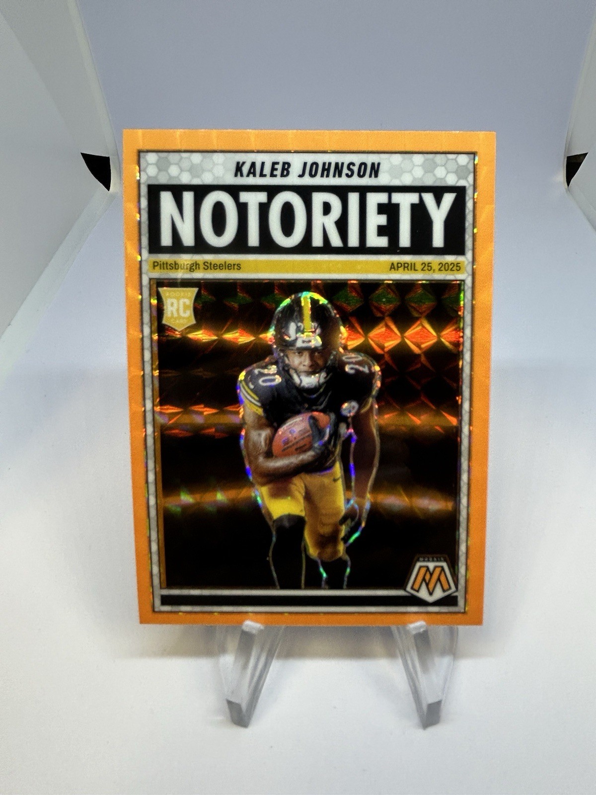 2025 Mosaic Kaleb Johnson Notoriety Mosaic Orange Fluorescent (RC) #22