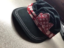 Disney Parks Minnie Mouse black with red bow baseball cap. Adjustable closure.