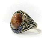 Sterling silver ring with a light-transmitting, striped Sulemani agate