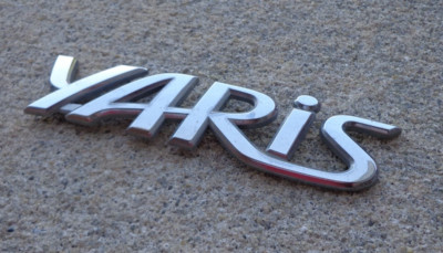 Toyota Yaris emblem badge decal logo script rear trunk OEM Factory Genuine Stock