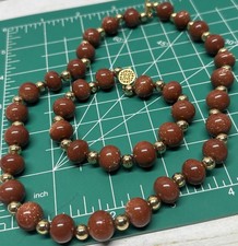 Gold tone brown glass beads with gold sparkles necklace and bracelet set