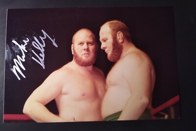 RARE PHOTOGRAPH OF THE KELLY TWINS SIGNED BY MIKE KELLY. LIFETIME COA