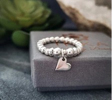 Sterling Silver stacker Thumb Stretch Beaded Ring With mini Heart Charm By INKA
