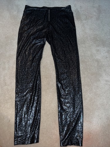 bebe faux leather snow leopardzipper front pant size small