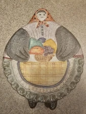 The Cellar - Macy’s Italy Round Lady Holding Basket Wall Decor - Trivet
