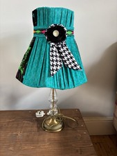 Vintage-style table lamp with a unique handmade dress-style fabric shade