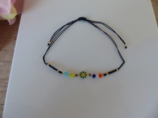 Bracelet boho fleur marguerite cordon noir - Bijoux des Lys