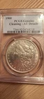 1900 MORGAN SILVER DOLLAR  PCGS GENUINE CLEANED-AU DETAILS