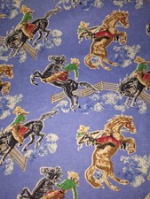 BTY Cowboys on Horses on Blue Flannel Cotton Quilt Fabric