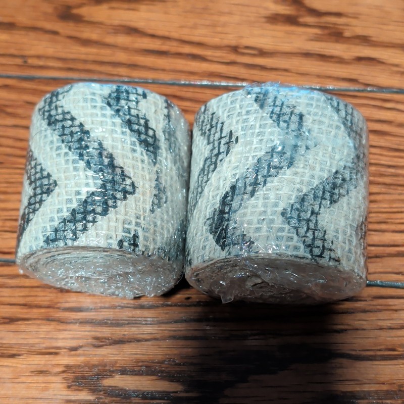 2 Rolls Of Burlap ribbon , White With Cheveron Print. Each Roll Is 3 Yards.