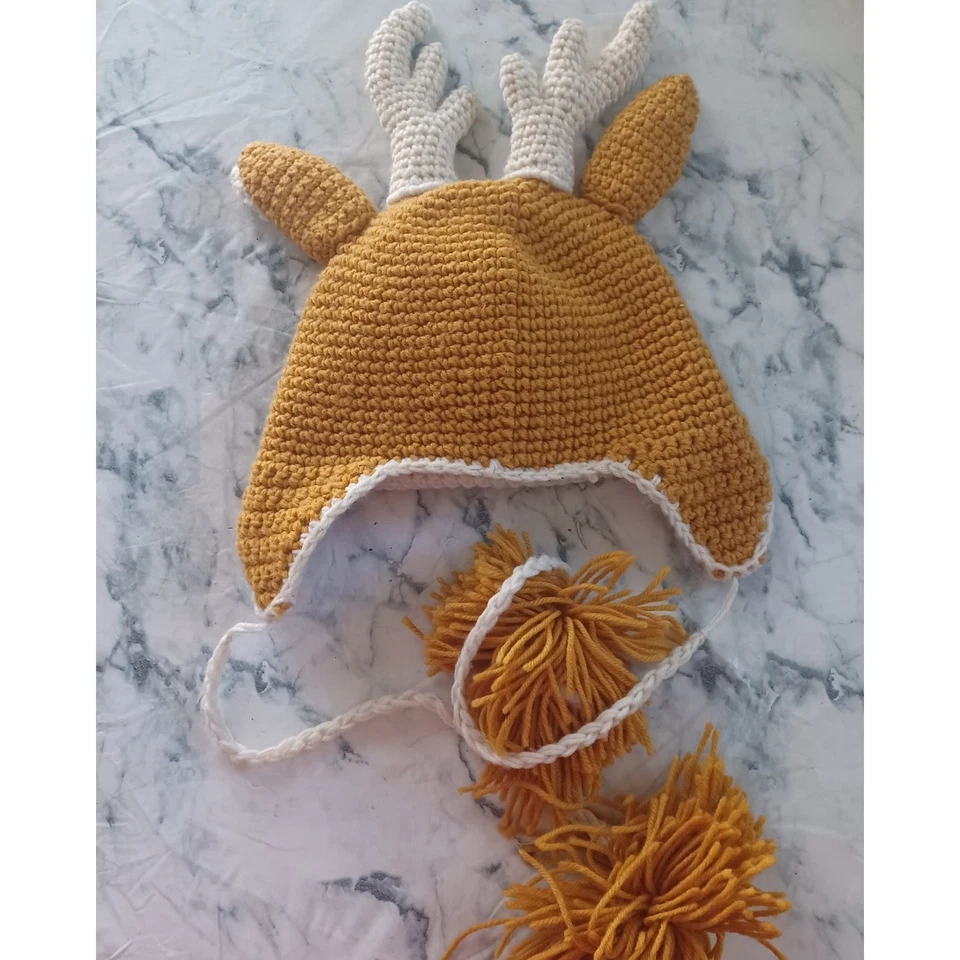 Sombrero de reno de ganchillo hecho a mano con astas y pompones gorro para niños pequeños Foto 3 de 3
