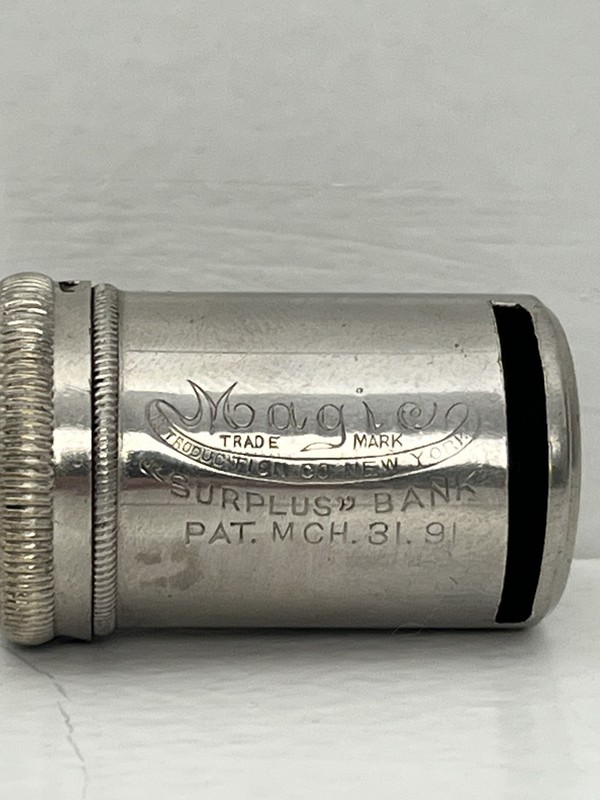 Magic "Surplus" Automatic Nickel Mechanical Coin Bank Pat. Mch. 31, 91