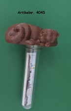 Geocachingversteck aus dem 3D Drucker: Hund mit Petling und Logbuch