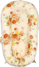 Dock-a-tot Deluxe Plus  baby lounger with a 100 cotton Mexxi floral cover