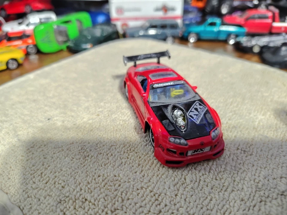 Muscle Machines Import Tuner Red 97 Toyota Supra T02-36 1:64 Die Cast Car - Image 2 of 4