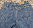 Blue high-waisted L.L.Bean mom jeans with two back pockets, brown leather patch on waistband, and yellow “L.L.Bean” tag.