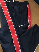 nike swoosh taped track pants black