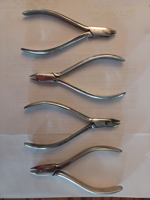 Orthodontic pliers-three pronged adjusting pliers
