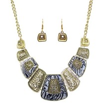 Black and white statement necklace and earring set with metal scroll designs New