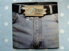 ZZ Top Vel Fly ('86 Remix) 2 Track Vinyl 7" (Fold Out Zipper Sleeve)