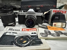 Asashi Pentax K1000 Multiple Lenses And flash Attachments with Case, and manuals