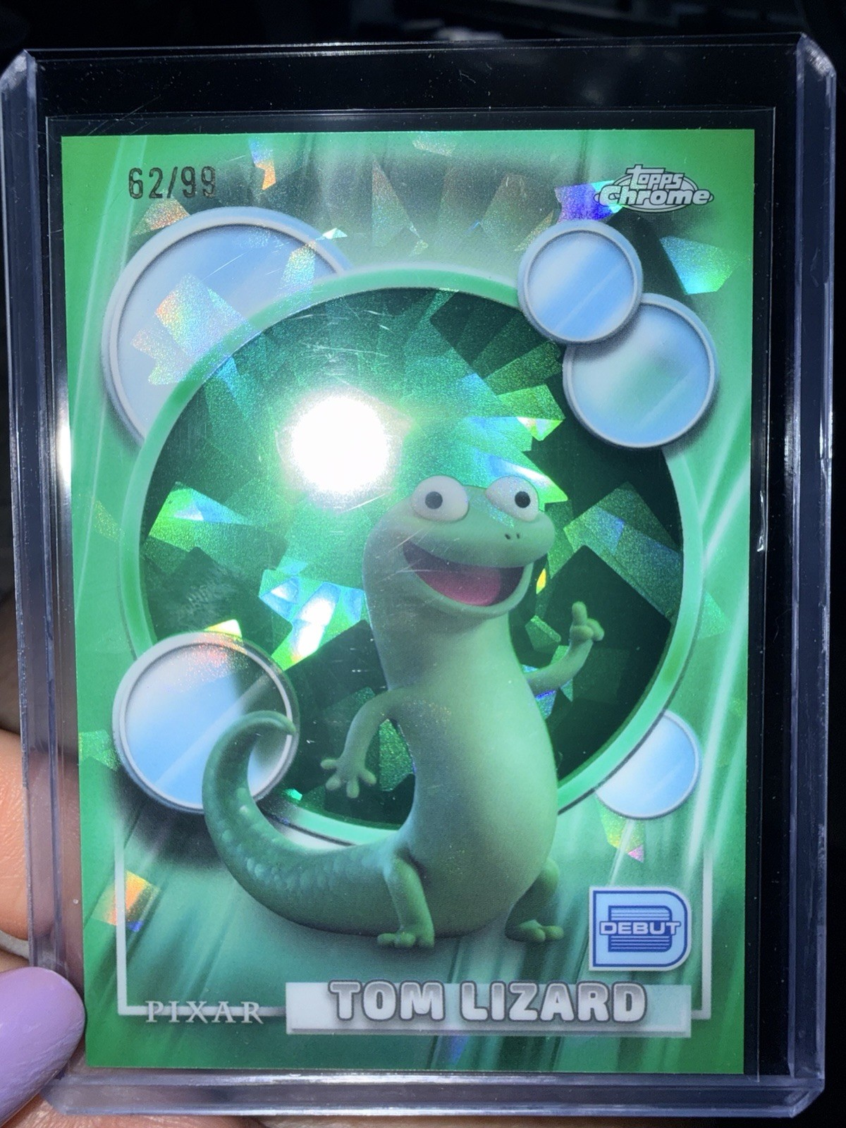 2026 Topps Chrome Sapphire Disney Tom Lizard (Debut) Green 62/99 #114