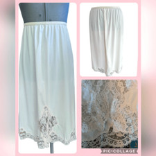 vintage women's 60s light pastel pink nylon slip with lace trim