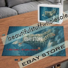 500 piece jigsaw puzzle Snow leopard resting alpine wildlife portrait