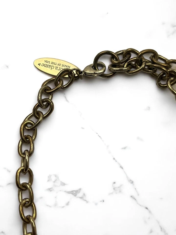 Collar llamativo tono dorado brote flor cristal LENORA DAME $140 Foto 3 de 4