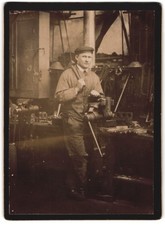 Photography Locksmith / Toolmaker on Vice with Hammer and Chisel 